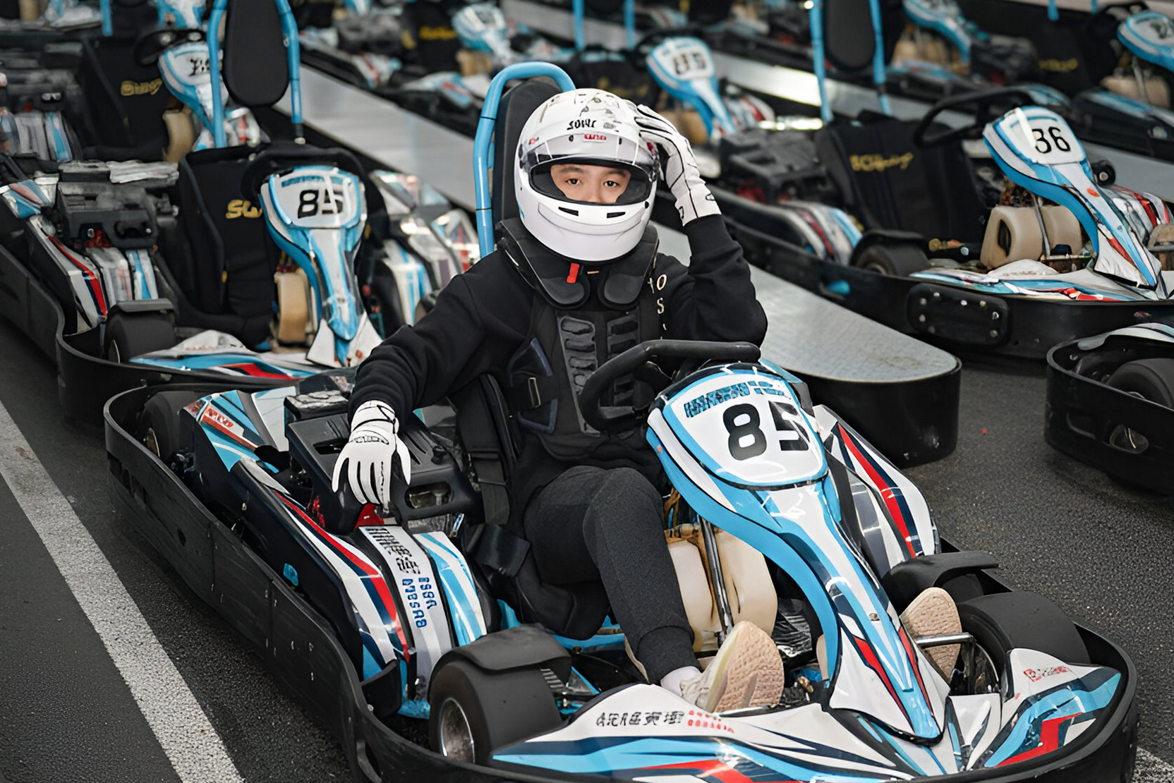 Jerry driving a kart at a track